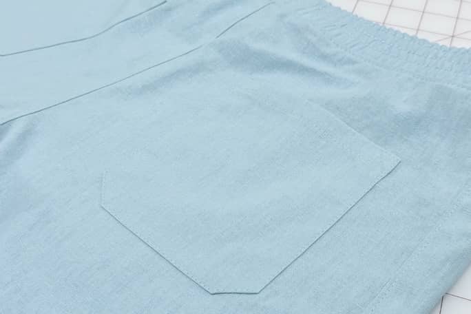 Back patch pocket on sea foam blue cotton linen Bamberton Shorts