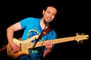 Alain Pérez Singing & Playing Bass