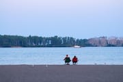 Couple Sitting on Cherry Beach